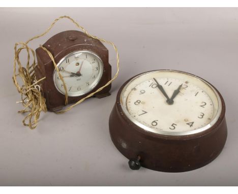 A Smiths bakelite wall clock, along with a Smiths bakelite electric alarm clock.  