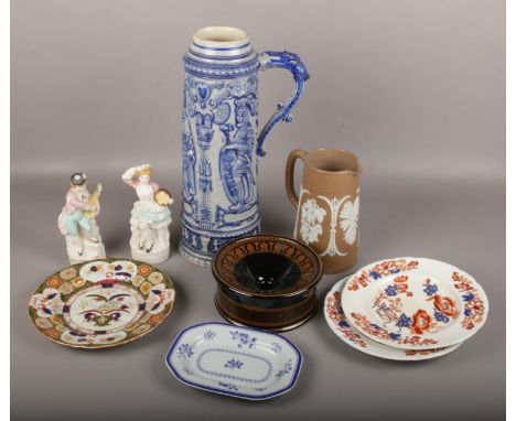 A large German Westerwald pottery ewer, Jasperware jug, spitoon, pair of coloured bisque figures, a 19th century Masons plate