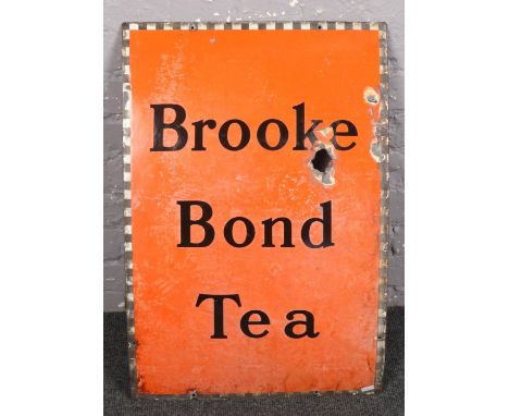 A 1940s enamel advertising sign for Brooke Bond Tea.  
