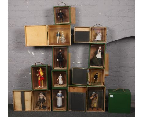 Ex museum display, 11 cased dolls depicting scenes from Victorian and Edwardian life including policeman, jester, navvy,house