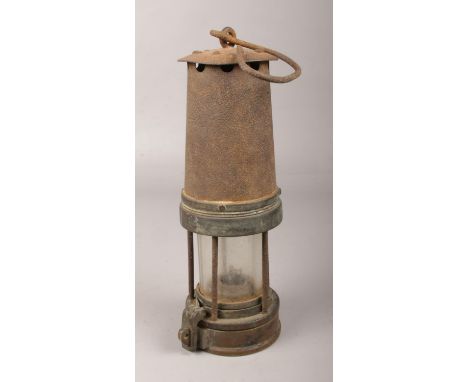 A vintage miner's lamp.  