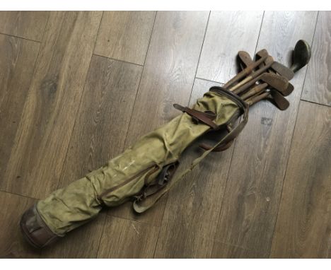 A collection of vintage golf clubs