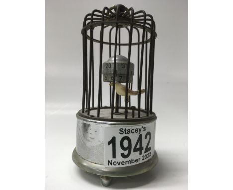 An automaton miniature bird cage clock. 12cm in height approx