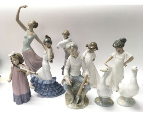 A Collection of 9 Nao Figures.
