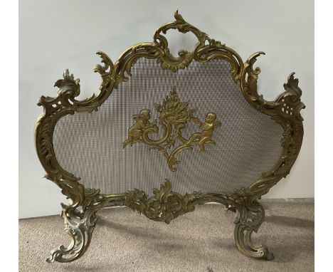 A French gilt bronze and wire mesh baroque style fire screen. 70cm x 71.5cm