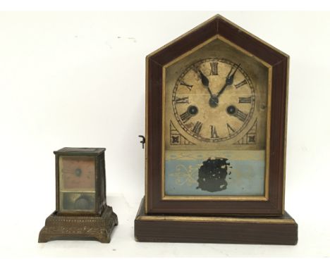 Old American shelf clock with key and pendulum and a miniature clock