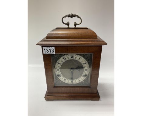 A Garrard and Co. cased mantle clock. With presentation panel. 33cm.