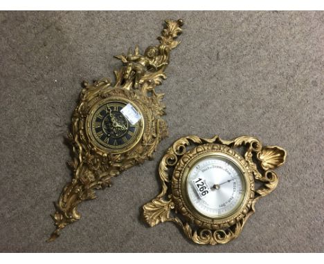 An ornate gilt metal wall clock - the dial having Roman numerals, surrounded by cherub. Together with a small barometer in a 