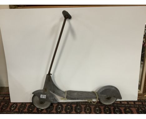 A 1950s vintage childâ€™s scooter. Needs attention.