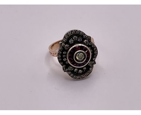 A vintage style 8ct rose rose gold and silver ring set with rose cut diamonds and rubies.