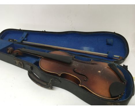 A 3/4 size violin in a fitted case with bow for restoration with applied Antoninus Stradivarius label.