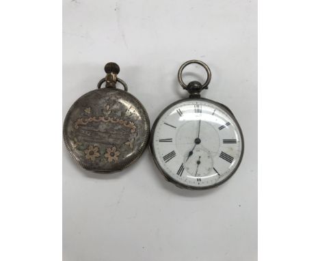 A omega pocket watch with engraved case button wind together with a silver casePocket watch.