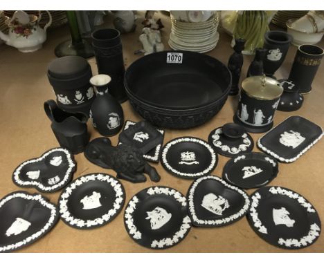 A collection of Wedgwood Jasper ware with raised classical decoration together with two chess pieces and a lion