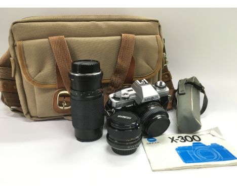 A Minolta X300 camera, lenses and accessories. NO RESERVE