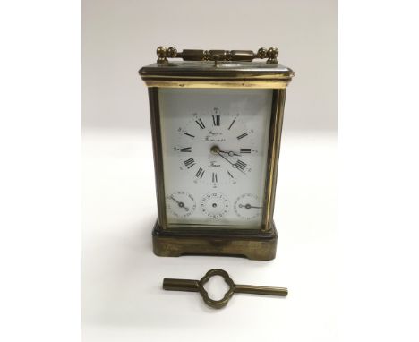 A French brass cased carriage clock, comes with key.