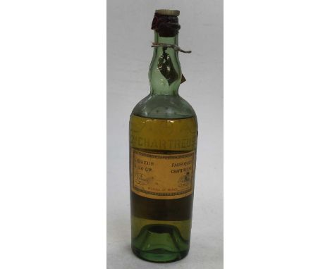 A vintage bottle of Chartreuse green liqueur, circa 1956Seal to bottle is broken.Level low shoulder.No evidence of leaking wh