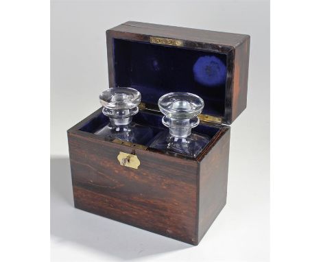 Fine Victorian coromandel decanter box containing two decanters for whiskey and gin. with gilded brass recessed handle in the