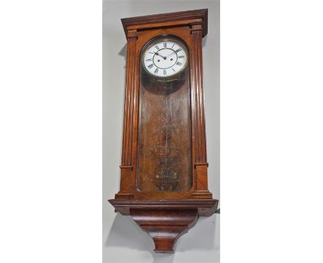 Late 19th Century Vienna wall clock, the concave cornice above reeded column sides to the long glazed case, the white enamel 