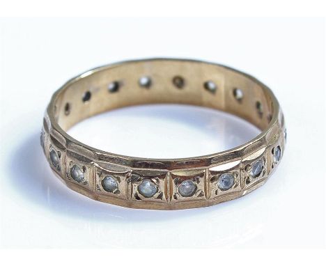 9 carat gold eternity ring, set with clear stones, ring size L