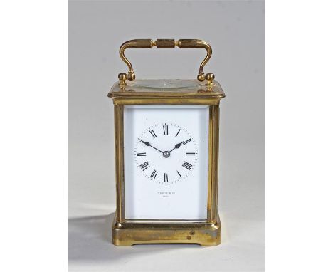 French gilt brass carriage clock, the corniche case with bevelled glass to the top, sides, front and back, with a white ename