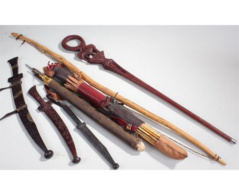 African items, to include a bow and quiver with arrows, another, two daggers and another dagger, together with a walking stic