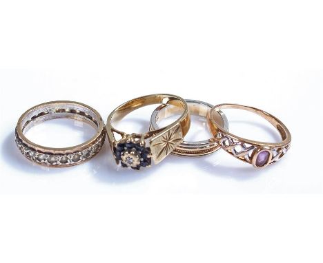 9 carat gold rings, to include an eternity ring, a band, a chequer example and a sapphire flower head example, (4)