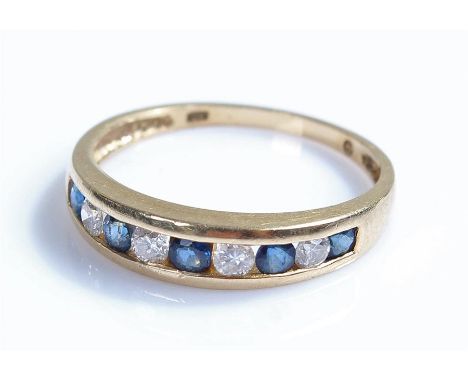 14 carat gold ring, with sapphires and white stones, ring size L