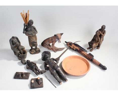 African figures, in various poses, together with a figure of a fox, an axe and clay pot of large proportions, (qty)