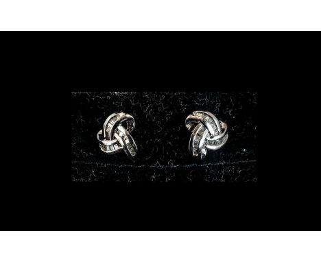 Diamond Triple Knot Stud Earrings, comprising baguette cut diamonds totalling .33ct, set in platinum vermeil and silver post 