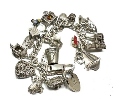 Vintage Silver charm bracelet with opening charms etc weight 106g