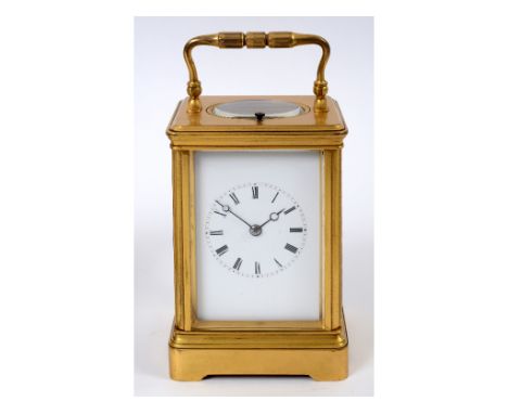 A carriage clock, with repeat, the 6 cm wide enamel dial with Roman numerals, fitted an eight day movement, striking on a bel