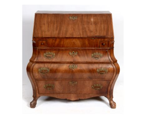 A Continental mahogany bombé bureau commode, on claw and ball feet, 112 cm wide  See illustration 