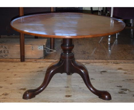 A 19th century mahogany tripod low table, 95 cm diameter 