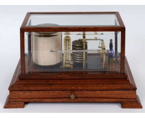 An Aitchison London barograph, with thermometer, in a glazed oak case with chart drawer, 38 cm wide  See illustration