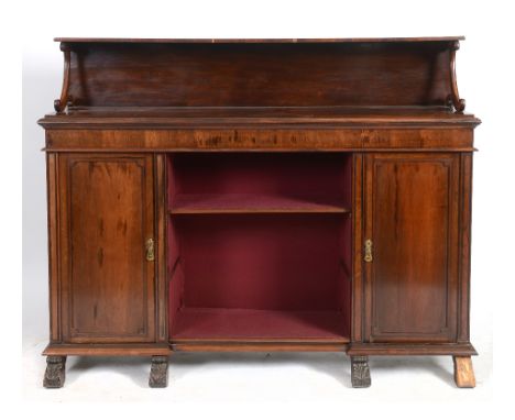 A Victorian rosewood bookcase, having a shelf above a recess, flanked by two cupboards, 178 cm wide  See illustration