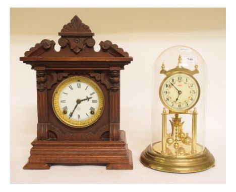 A glass dome clock, the 10 cm diameter dial signed Kundo, 29 cm high, and a mantel clock (2)