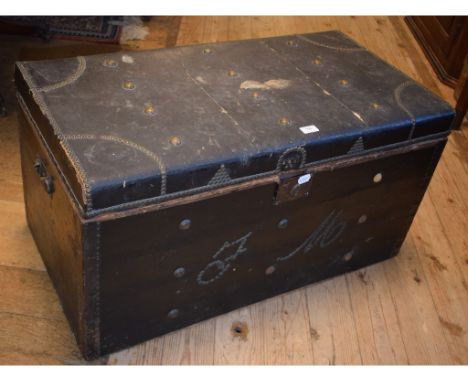 An 18th century oilskin covered studwork trunk, initialled FM, 90 cm wide