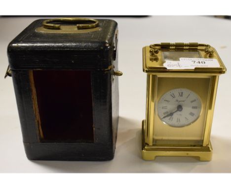 A brass carriage clock, modern, in an associated leather travelling case (2)