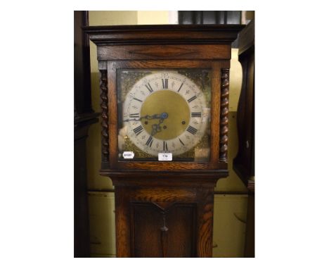 A longcase clock, the 26.5 cm square brass dial with silver chapter ring and Roman numerals, fitted a movement striking on a 