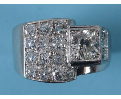 An Art Deco style diamond ring, in a white coloured metal mount, approx. ring size J  See inside front cover colour illustrat