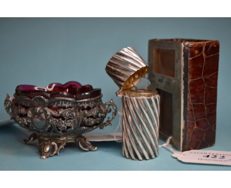 A silver mounted leather matchbox cover, Birmingham 1903, a silver cased scent bottle, and a silver coloured metal salt, with