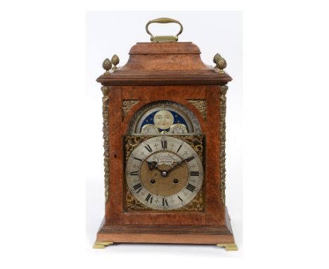 A George III style bracket clock, the brass arched dial with phase of the moon and silver chapter ring with Roman numerals, s