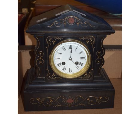 A late Victorian slate mantel clock, 26 cm wide, a porcelain encrusted oval mirror, a model ship and a lamp (4)   Condition r