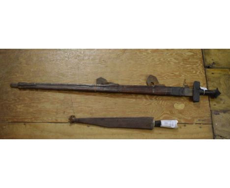 An African sword, in a leather scabbard, damaged, and a similar dagger (2)