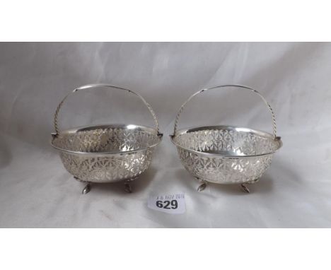 Pair of bonbon baskets pierced sides bracket feet  4” dia. Chester 1911 150g.      