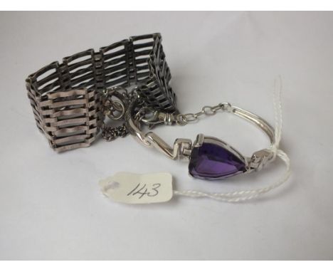 A silver gate bracelet and another set with a   purple stone        