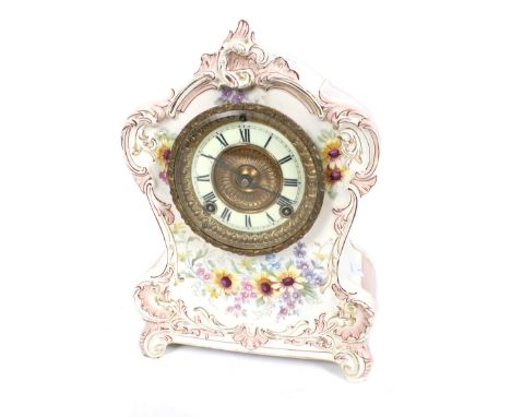 An Ansonia USA 8 day striking Royal Bonn ceramic mantel clock. Striking to a gong, gilt and white enamel dial with Roman nume