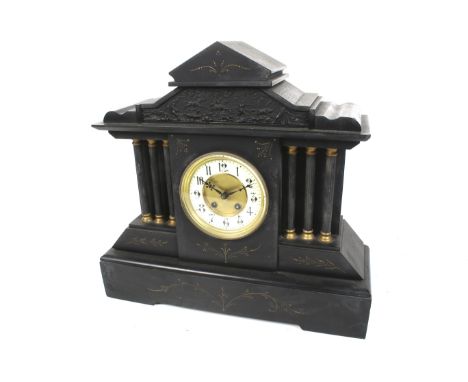 A 19th century black marble mantel clock. Striking to a gong. White enamel chapter ring with Arabic numerals and gilt metal b