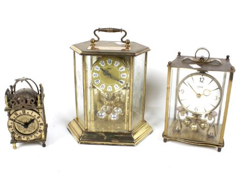 Three 20th century clocks. Including two anniversary mantel clocks and a lantern style clock with electric movement. Max. H21