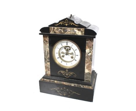 A 19th century Henri Marc of Paris mantle clock. The circular enamel dial with Roman numerals and visible escapement, the mov